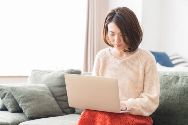 istock young asian woman using laptop 1336399166