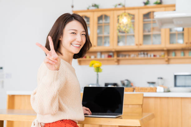 istock young asian woman using laptop 1336399174