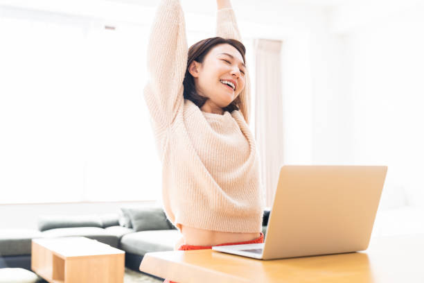 istock young asian woman using laptop 1336399198