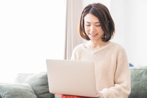 istock young asian woman using laptop 1336399212