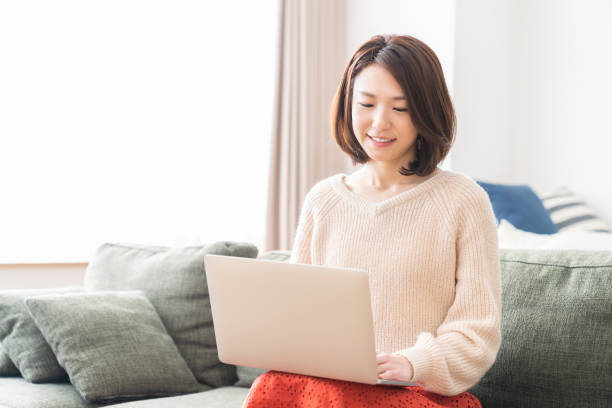 istock young asian woman using laptop 1336399309