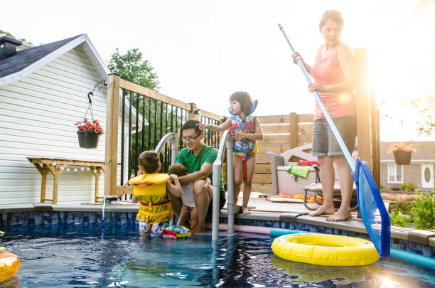 istock Parents and Mixed race (Chinese and caucasian) children entering in pool 1336403289