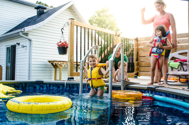 istock Parents and Mixed race (Chinese and caucasian) children getting ready for pool 1336404193