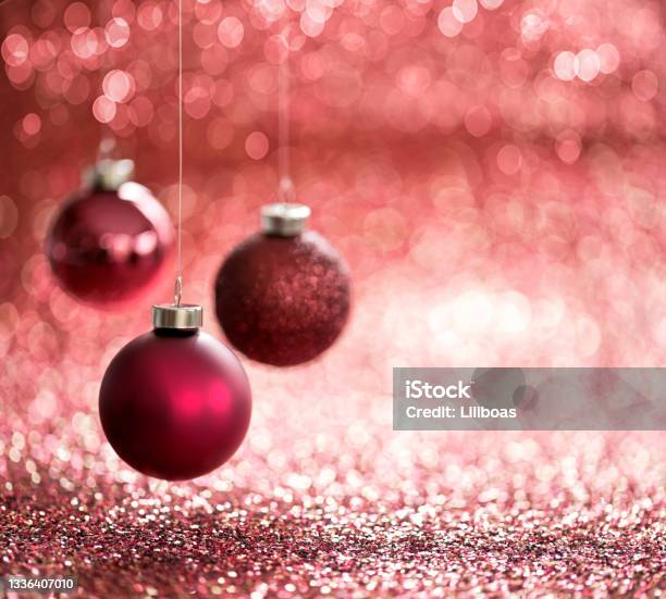 Christmas Red Baubles On A Red Ackground Stock Photo - Download Image Now - Backgrounds, Beauty, Brightly Lit