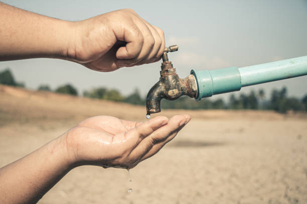Hand for drinking water to live through drought, Concept drought and crisis environment.