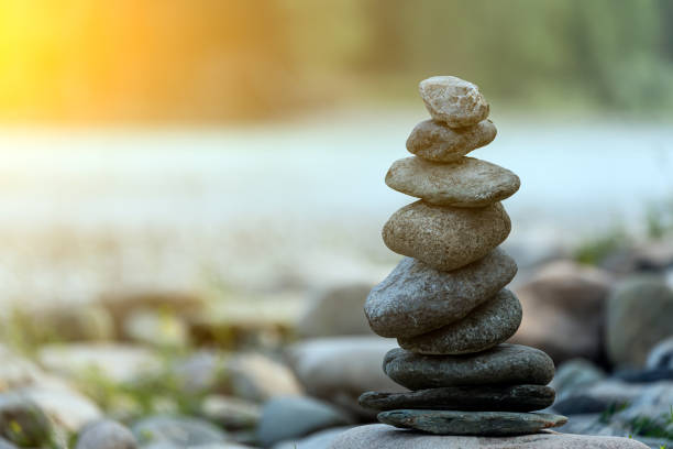 istock Pyramid of round gray stones 1336410422