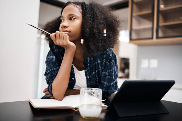 boring homework pictures Shot of a young girl looking unhappy while doing a school assignment at home Recess would be awesome right now boring homework twelve stock pictures, royalty-free photos & images
