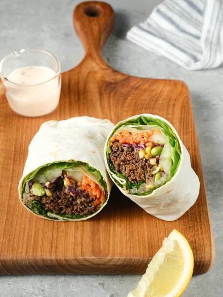 istock Salad Wrap. Tortilla wraps with beef teriyaki and fresh vegetables. 1336411973