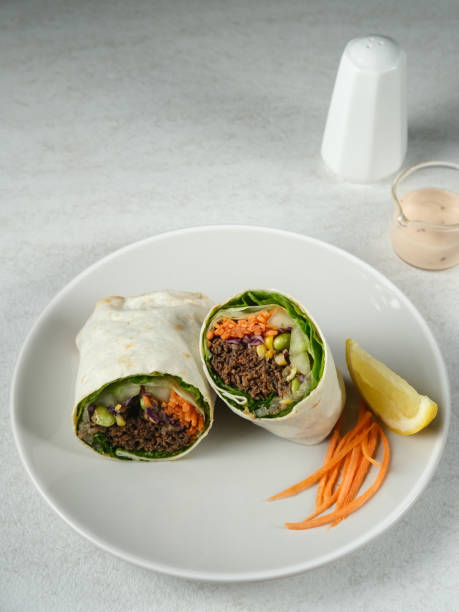 istock Salad Wrap. Tortilla wraps with beef teriyaki and fresh vegetables. 1336411997