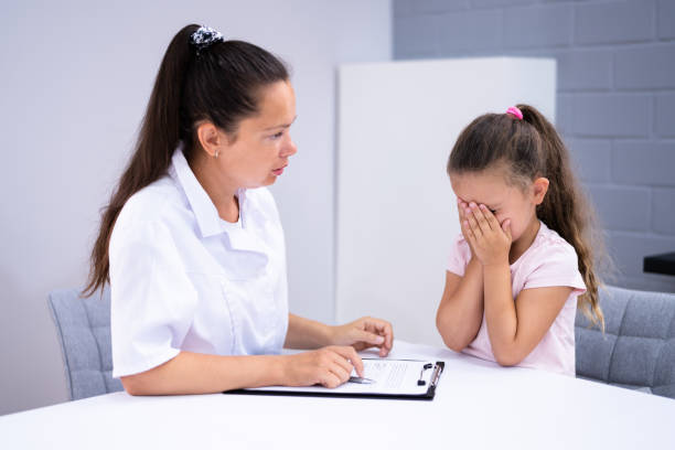 istock Sick Child Therapy. Therapist Comforting Kid 1336413773