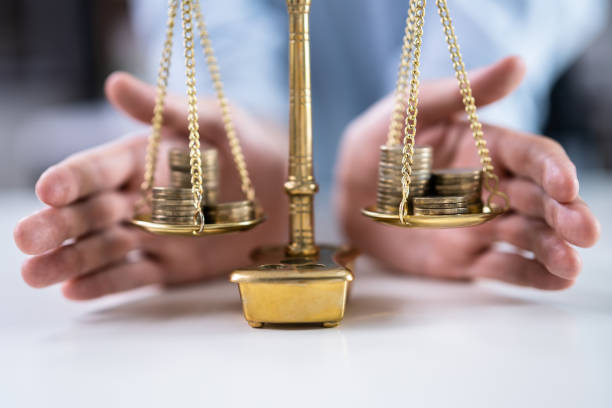 istock Money Balance On Scale 1336414452