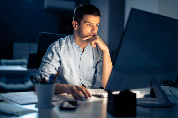 istock Business Analyst Businessman Working Late On Computer 1336414599