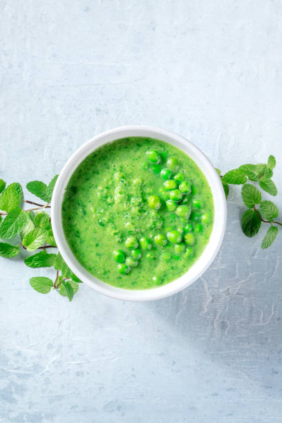 istock Vegan soup with green peas and mint, shot from above with copy space 1336419054