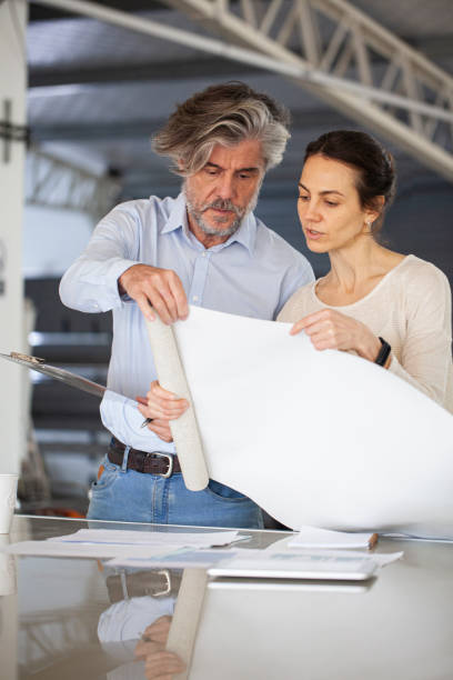 istock Sustainable engineers sharing ideas inside sustainable factory 1336419084