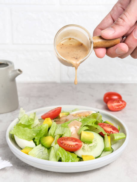 istock Green salad from green leaves mix vegetables, with tomatoes and egg. 1336419169