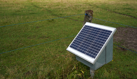 Solar panel providing energy for a movable electric fence.  Modern agriculture.