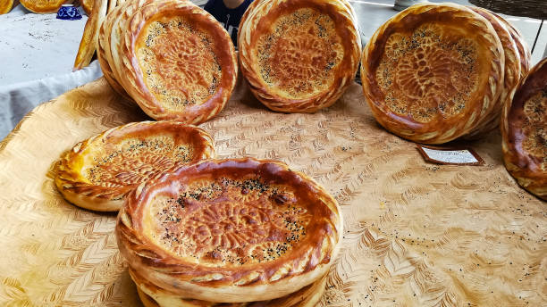 istock Samarkand flat bread in its typical donut shape with symbols and drawings. 1336425302