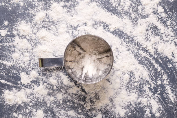 istock Baking or cooking background, flour on the dark background 1336425986