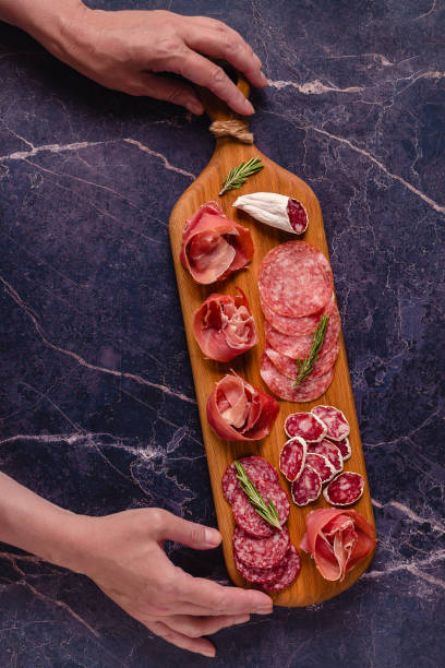 istock Serving board with a set of different meat snacks 1336426592