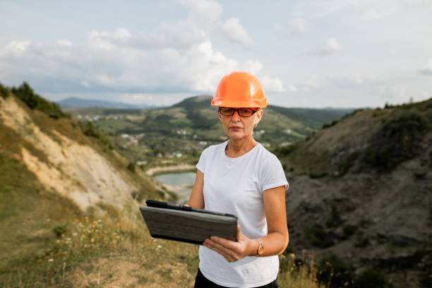 istock Senior female engineer architect uses tablet to work 1336429622