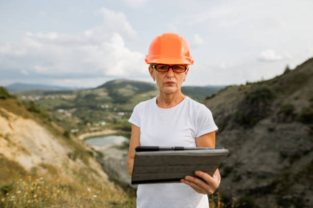 istock Senior female engineer architect uses tablet to work 1336429634