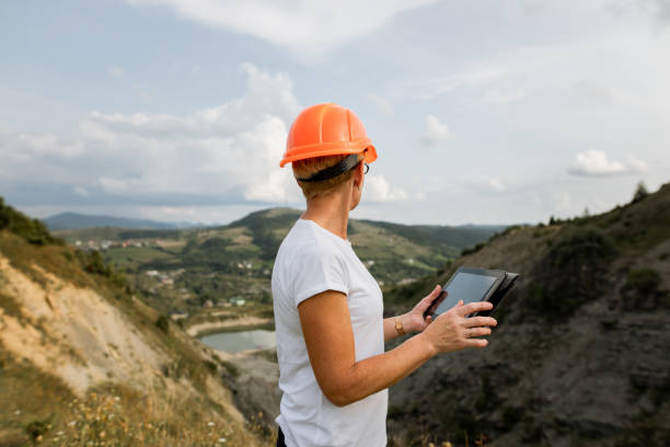 istock Senior female engineer architect uses tablet to work 1336429645