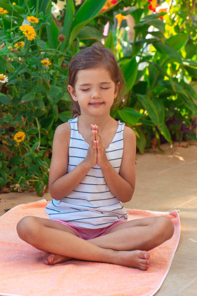 istock Little Girl Meditating 1336430863