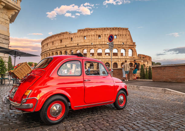 Little red old Fiat 500 in front of coliseum at sunset Rome, Italy 17.07.2021: Little red old Fiat 500 in front of coliseum at sunset with picnic basket on rear little fiat car stock pictures, royalty-free photos & images