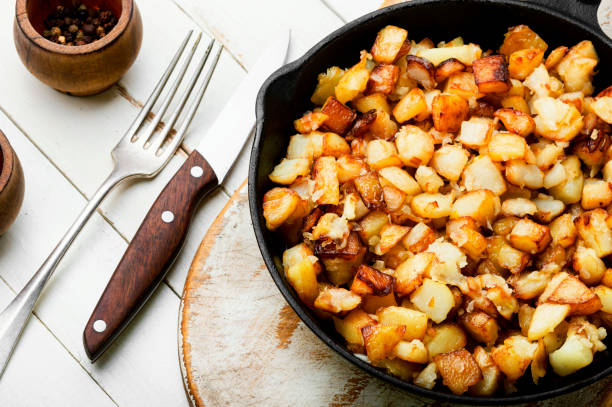 istock Roasted potatoes in iron skillet 1336432276