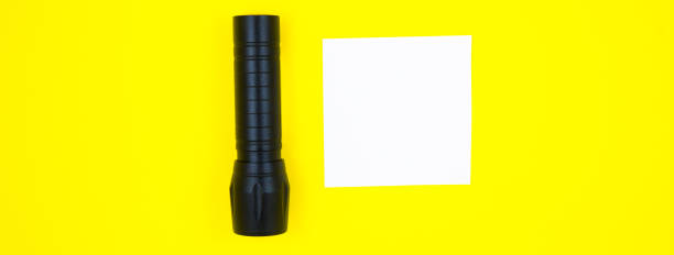 istock Blank white To Do List Sticker with black flashlight. Searching information on the Internet. Close up of reminder note paper on the yellow background. Copy space. Minimalism, original and creative. 1336432966
