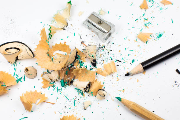 istock Sharpener and a broken pencil. Shavings and a graphite on white background. Close up, Macro photo. Back to school concept. 1336433134