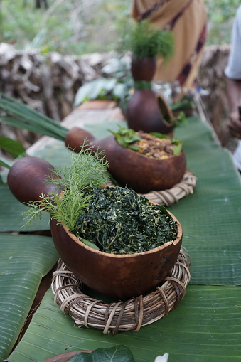 The food is served using bottle gourds.