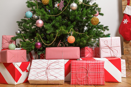 Close-up of christmas gift boxes under a tree