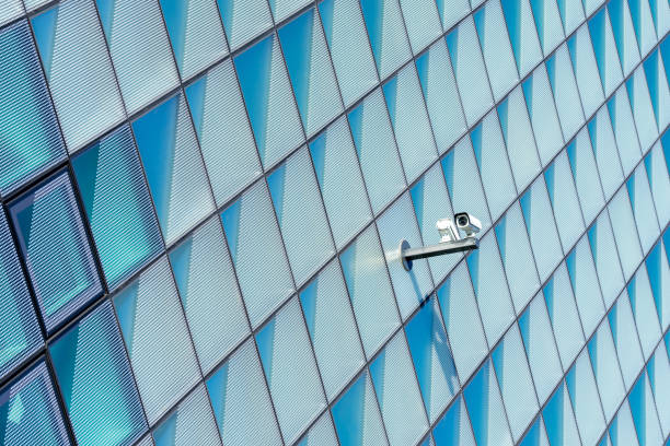 istock Low Angle View Of Security Camera Against Modern Building 1336440590