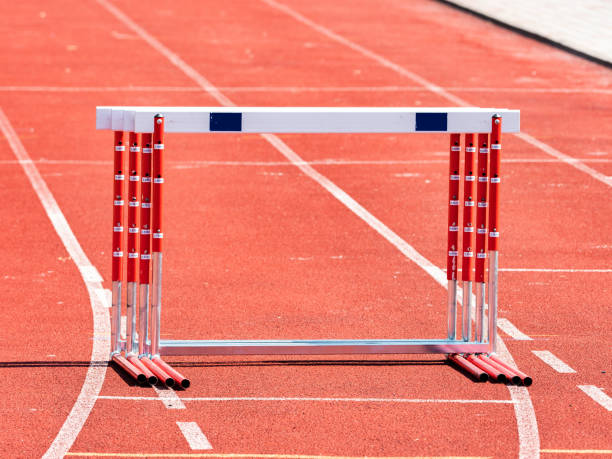 istock Hurdles And Red Running Tracks In A Stadion. Beginning Of Athletic Training 1336440608