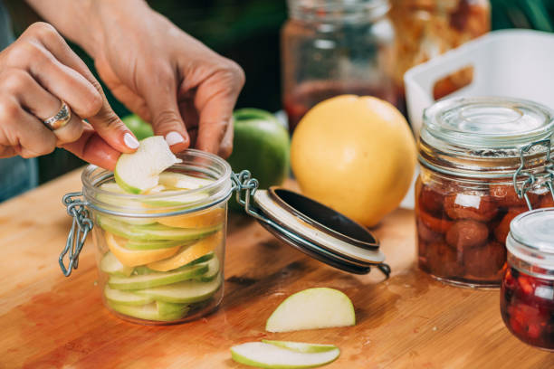 istock Fermentation Food At Home. Woman Preparing Fruits For Fermentation. 1336441049