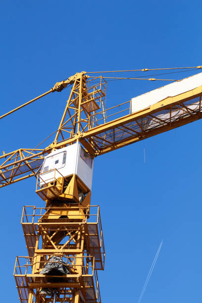 istock High tower construction crane with blue sky background. 1336441388