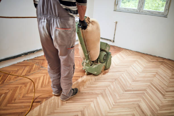 istock Repairman restoring parquet with a sanding machine. 1336442303
