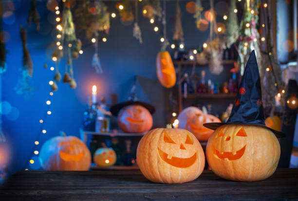 istock Halloween pumpkins on old wooden table on background Halloween decorations 1336446355