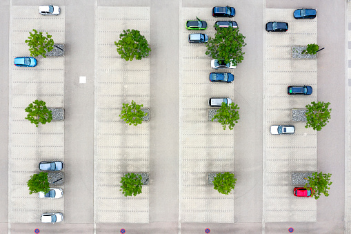 Cars in a parking lot viewed directly from above.