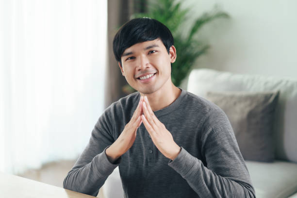 istock Young Asian deaf disabled man using Sign Language to communicate with other people. 1336447484