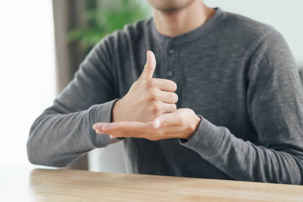 istock Young Asian deaf disabled man using Sign Language to communicate with other people. 1336447487