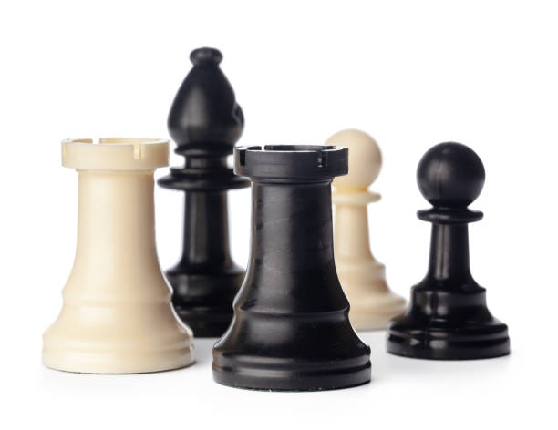istock Black and white chess pieces on white background 1336447673