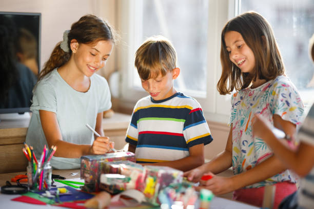 Boys and girls having fun drawing together