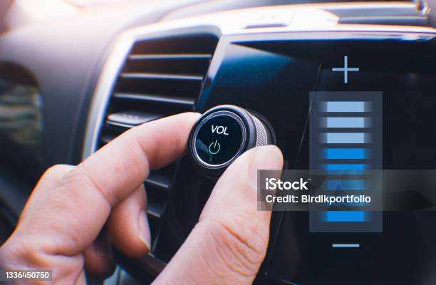 Car Owner Hand Turning Volume Button Stock Photo - Download Image Now - Radio, Car, Noise