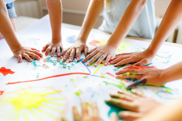 group of children having fun whit colors - early childhood education imagens e fotografias de stock