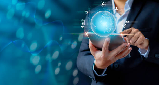 istock Businessman holding tablet showing virtual globe diagram. 1336453394
