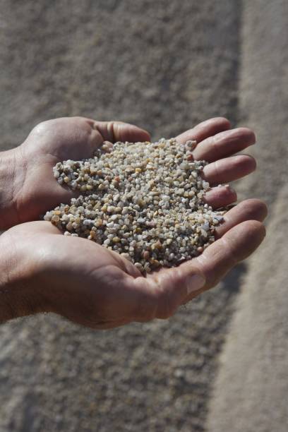 istock gravel sand in man hands in quarry showing camera 1336453557