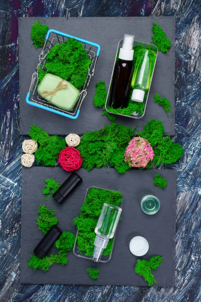 istock Soap, with green moss, cosmetics on a dark background, moss. Vertical photo 1336457828