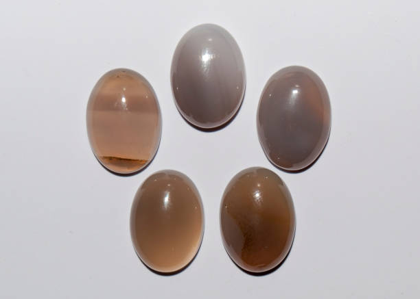 istock Natural oval grey agate cabochon on the white background 1336457913
